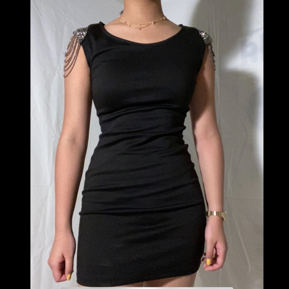 black bodycon dress with beads on the sleeves